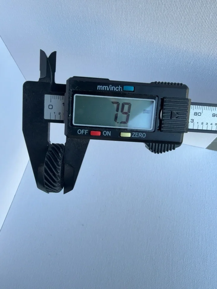 Caliper photograph showing 7.9 mm across the pictured thickness contact points