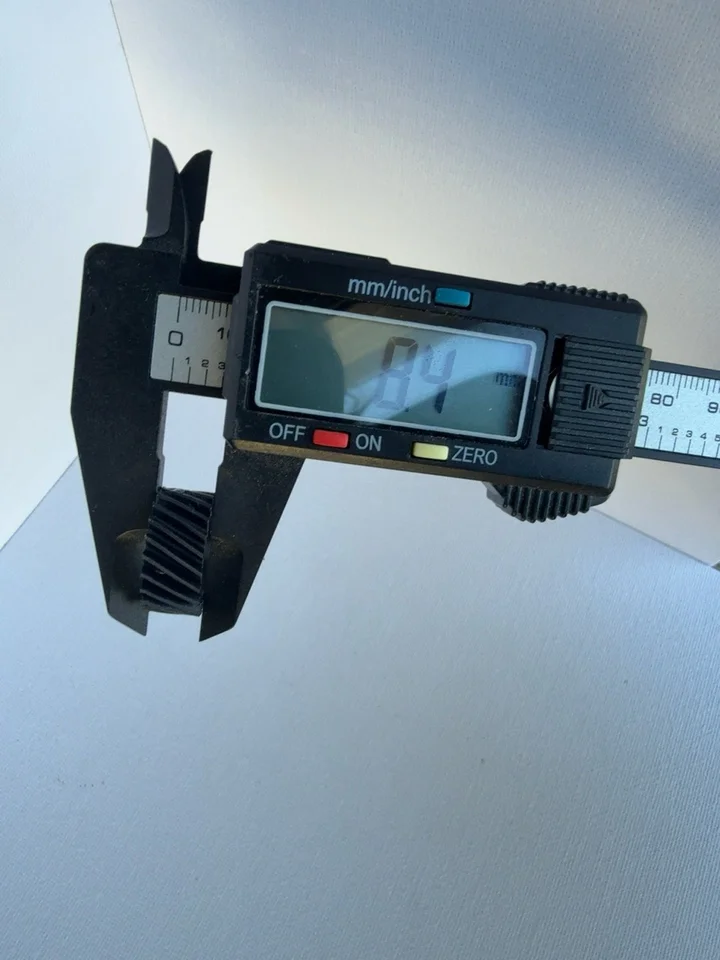 Caliper photograph showing 8.4 mm across the pictured thickness