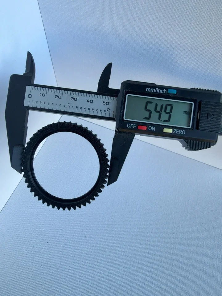 Caliper photograph showing 54.9 mm across the pictured outer contact points