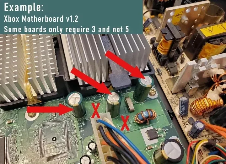 Original Etsy reference photograph showing an Xbox v1.2 motherboard with three capacitor positions